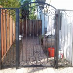 Black Iron Door with scroll and knuckle design